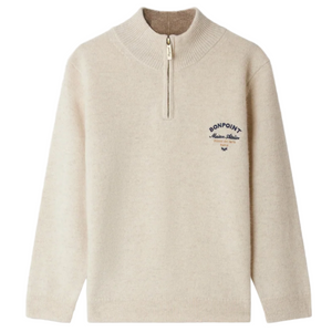 The Bonpoint Boys' Gert Cashmere Sweater features a beige design with a trucker collar and blue "Bonpoint Maison Atelier" embroidery on the left chest.