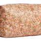 The Trousse Quilted Pencil Case in coated Liberty fabric by Bonpoint features a pink and brown floral pattern, top zippered closure, and handle loops—ideal for organizing baby essentials or stationery.