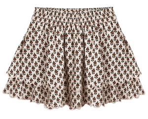 The Girls' Rose Mini Skirt by Rylee & Cru features scalloped tiers and an elastic gathered waist, with a brown and green floral print on a cream background.