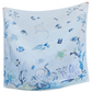 The Timo & Violet Shawl Blanket features light blue organic cotton with playful sea creatures—fish, octopus, turtles, stingray, and coral—creating a gentle underwater scene. Ideal as a baby accessory or shawl blanket for cozy comfort.