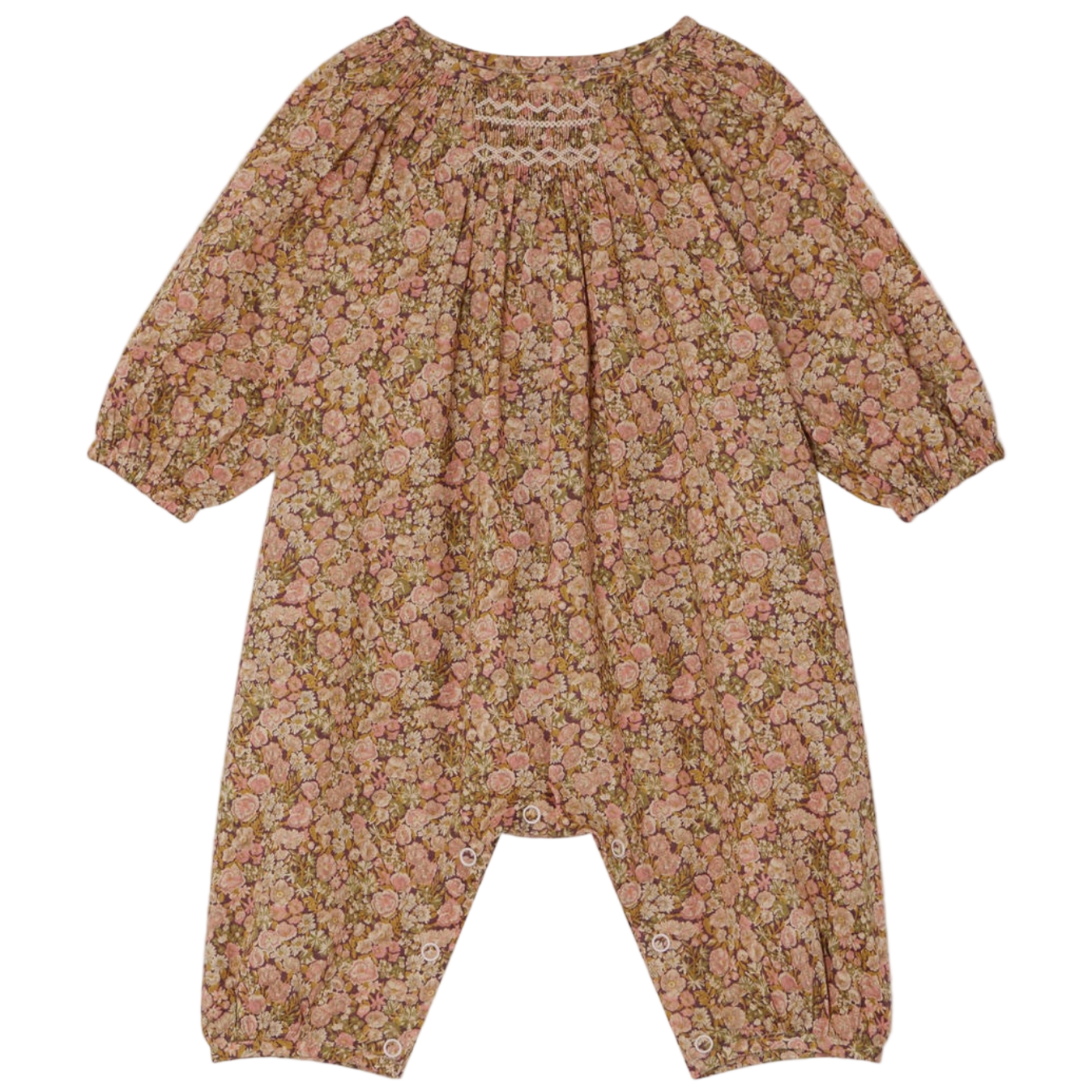 The Bonpoint Baby Girls' Jia Smocked Jumpsuit in Liberty Fabric features long sleeves, a pink and brown floral print, gathered neckline, elastic cuffs, hand-embroidered smocking, and snaps at the legs.