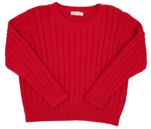 A Baby and Kids' Crawford Crewneck by The Beaufort Bonnet Company in Richmond Red is laid flat, showing its long sleeves, cable-knit texture, and ribbed cuffs, hem, and collar.