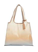 The 3.1 Phillip Lim Coated Ombre Canvas Market Tote is a spacious, glossy bag with a beige ombre design, brown trim, double handles, and a stylish hanging tag.