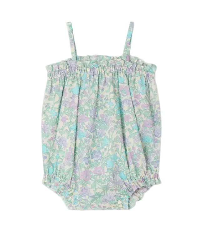 The Bonpoint Baby Girls' Nefle Romper features a pastel floral Liberty fabric, thin shoulder straps, elasticized top and leg openings, and is shown against a white background.