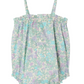 The Bonpoint Baby Girls' Nefle Romper features soft Liberty fabric, a pastel blue, green, and purple floral print, thin straps, and front buttons.