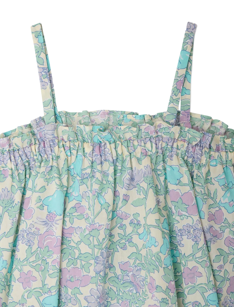 Close-up of Bonpoint's Baby Girls' Nefle Romper, featuring pastel Liberty fabric, thin shoulder straps, and a ruffled, gathered neckline—an elegant choice for baby outfits.
