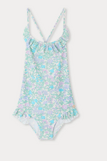 The Bonpoint Girls' Lacy One Piece Swimsuit features a Liberty fabric in light blue, pink, and lavender floral print with a ruffled neckline and crisscross spaghetti straps, shown on a white background.