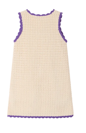 The Girls' Lali Hand-Crocheted Dress by Bonpoint is a cream sleeveless crochet dress with purple scalloped trim on the neck, armholes, and hem—ideal for summer.
