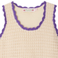 The Bonpoint Girls' Lali Hand-Crocheted Dress is a sleeveless cream dress with purple scalloped trim along the neckline and armholes—a charming handmade piece for any occasion.