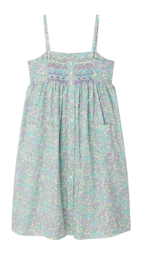 The Girls' Passion Dress by Bonpoint is a sleeveless, light blue and lavender floral sundress crafted from Liberty fabric, featuring thin straps, a hand-embroidered smocked buttoned bodice, and a gathered skirt.
