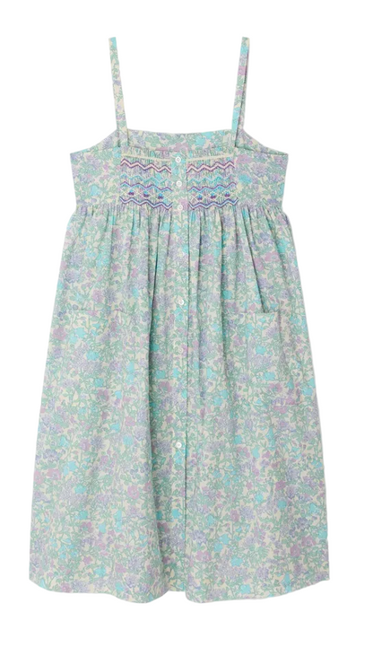 The Girls' Passion Dress by Bonpoint is a sleeveless, light blue and lavender floral sundress crafted from Liberty fabric, featuring thin straps, a hand-embroidered smocked buttoned bodice, and a gathered skirt.