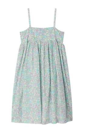 The Girls' Passion Dress by Bonpoint is a sleeveless sundress made from organic cotton, featuring thin straps, a gathered skirt, and a floral print in light blue, purple, and green tones.