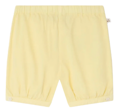 The Bonpoint Baby and Kids' Azur Bloomer features light yellow organic cotton poplin, an elastic waistband, and gathered hems. Crafted for comfort, these bloomers are shown flat against a white background.