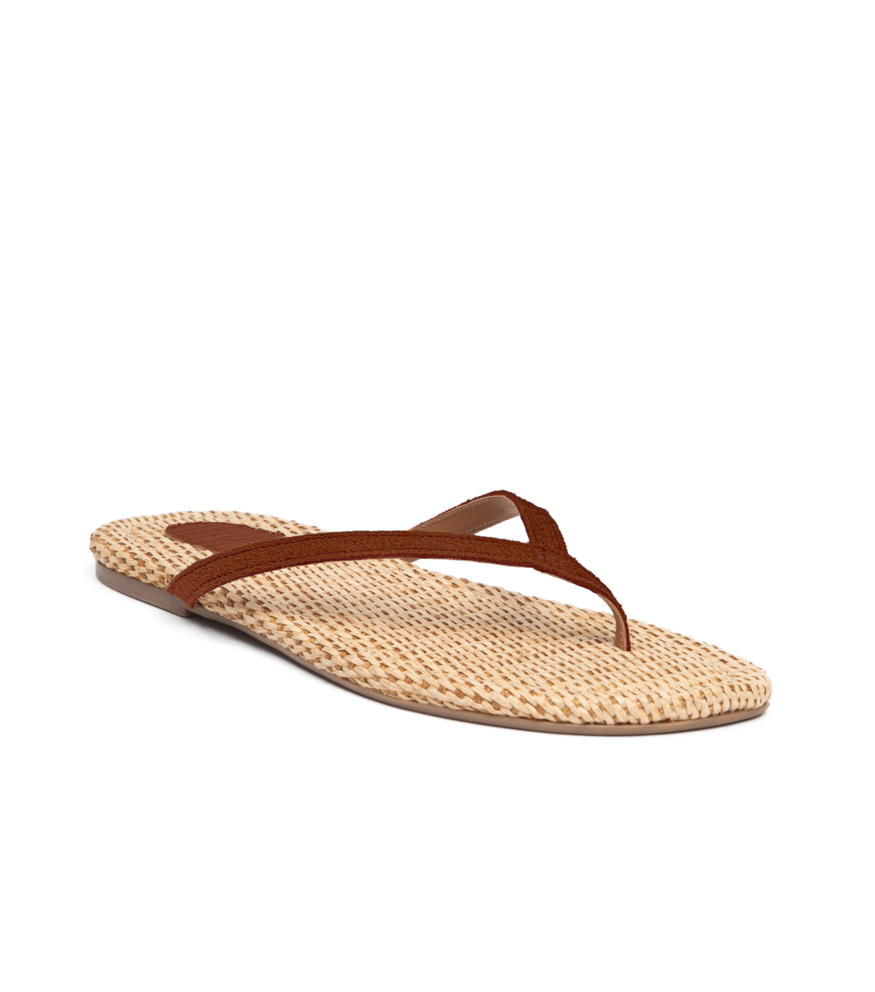 The Staud Freja Suede Thong is a beige sandal with brown straps and a flat sole, perfect for warm-weather outfits. Photographed on a white background.