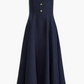Altuzarra Orrie Dress in a navy linen blend, styled with wide straps, a square neckline, and four vintage-inspired buttons on the bodice.