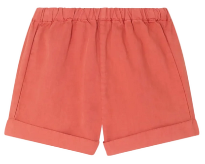 Bonpoint Baby Boys' and Boys' Ecady Shorts in coral, crafted from soft organic cotton with an elastic waistband and rolled-up hems, are displayed laid flat against a white background.