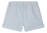 Bonpoint Baby Boys' and Boys' Ecady Shorts in light blue chambray, featuring an elastic waistband and rolled cuffs, shown flat on a white background.