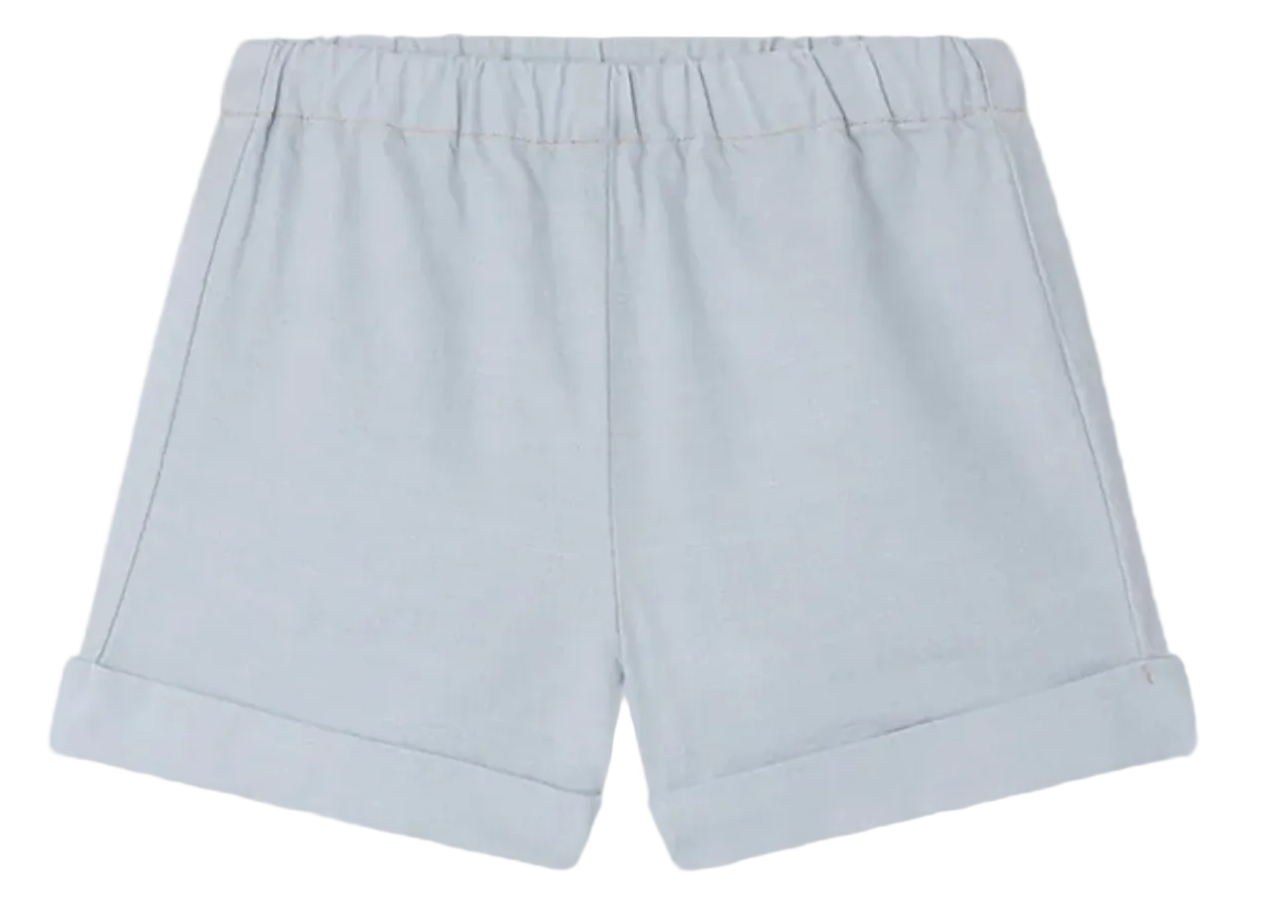 Bonpoint Baby Boys' and Boys' Ecady Shorts in light blue chambray, featuring an elastic waistband and rolled cuffs, shown flat on a white background.
