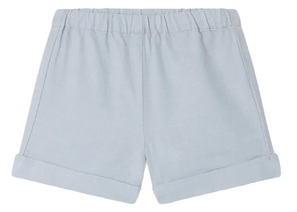 Bonpoint Baby Boys' and Boys' Ecady Shorts in light blue chambray, featuring an elastic waistband and rolled cuffs, shown flat on a white background.