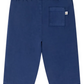Bonpoint's Baby Boys' and Boys' Dandy Indigo Trousers feature soft organic cotton, an elastic waistband, and a back pocket with a white tag—ideal for babies.