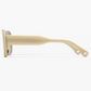 Side view of the Ily Sunglasses by Jimmy Fairly, featuring a beige rectangular silhouette crafted from translucent cellulose acetate with two small holes near the end of the temple arm, set against a white background—a refined example of German eyewear craftsmanship.