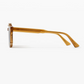 Side view of the Astie rectangular sunglasses by Jimmy Fairly, featuring an amber-colored thick acetate frame and arms, displayed against a plain white background.
