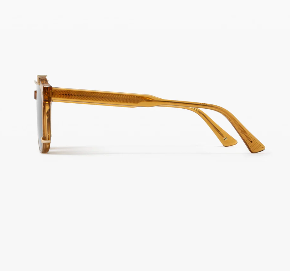 Side view of the Astie rectangular sunglasses by Jimmy Fairly, featuring an amber-colored thick acetate frame and arms, displayed against a plain white background.