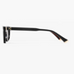 Side view of the Pippa frame by Jimmy Fairly in black cellulose acetate, featuring gold accents on the hinge and temple tip, shown against a plain white background.