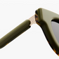Close-up of the hinge and arm of Jimmy Fairly’s Paoli sunglasses, featuring a butterfly frame in green and tortoiseshell with gold metal detailing, expertly crafted from premium cellulose acetate.