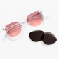 Jimmy Fairly’s Adrian sunglasses, featuring clear frames with pink lenses and a sturdy 5-point metal hinge, are displayed next to two black replacement lenses on a white background.