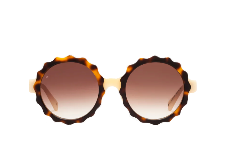 Lily by Jimmy Fairly: Round sunglasses featuring brown gradient lenses and a distinctive round acetate frame with tortoiseshell-patterned, scalloped edges, set against a white background.
