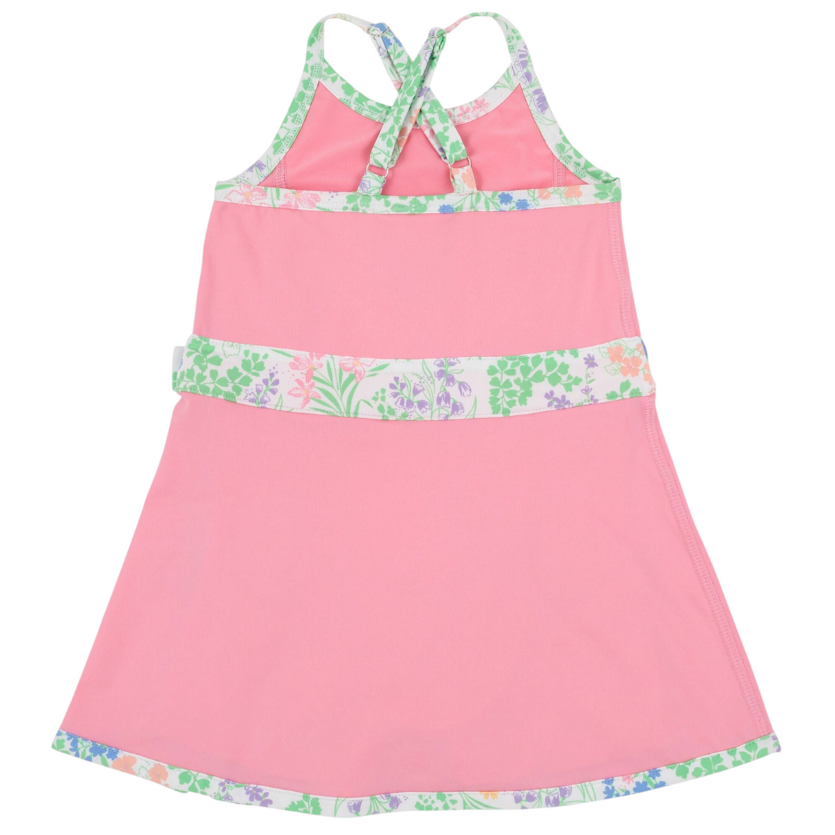 Girls’ Prepletic™ Teggy Tennis Dress by The Beaufort Bonnet Company in pink, featuring floral trim, crisscross back straps, and an A-line silhouette—an ideal choice for girls’ activewear—shown against a plain white background.