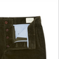 A close-up of the Sid Mashburn Field Pant in green wide-wale corduroy, featuring an open button fly with brown buttons and a light blue inner lining.