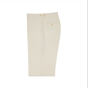 A pair of neatly folded Sid Mashburn Side-Tab Dress Trousers in ivory canvas, featuring a back pocket with button, made in Portugal and displayed on a white background.