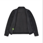 Sid Mashburn’s Work Jacket in black Italian goat suede is shown open against a white background, revealing interior pockets and a green label tag on the inside left pocket—a refined layering piece and versatile work jacket.