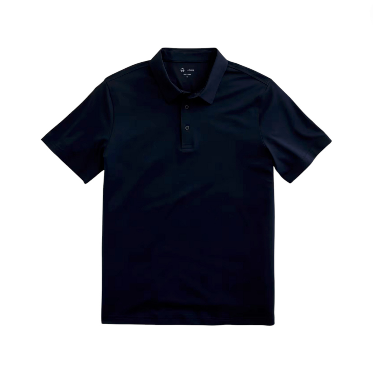 The AG Jeans Bryce Polo is a black short-sleeve performance shirt featuring a classic collar and three-button placket, displayed flat against a white background.