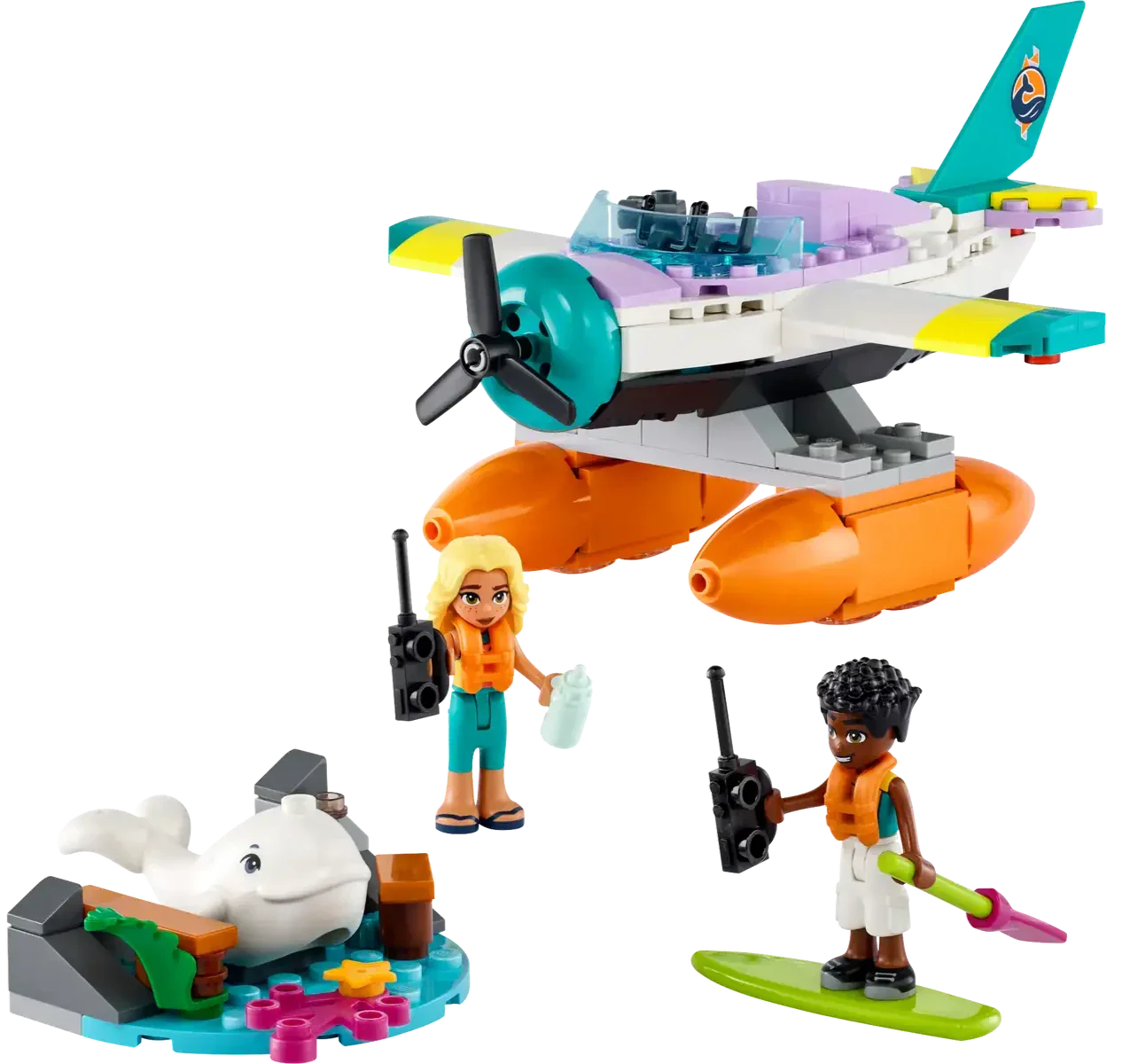 Two LEGO Friends figures, one blonde with a map and the other with dark curly hair holding a paddle, stand by the LEGO® Friends Sea Rescue Plane from Legos - Toyhouse. Nearby, a dolphin figure rests on blue LEGO pieces from this building toy set.