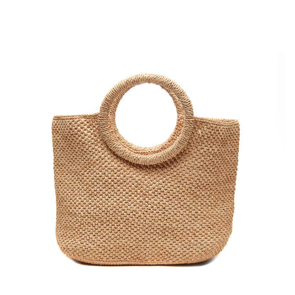 The Serena Tote by Mar Y Sol—a woven straw summer bag with a round handle and open top—is a customer favorite for effortless warm-weather style, shown against a plain white background.