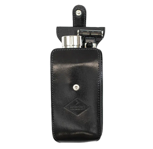 Barberino's Travel Set: black leather case with snap closure, includes a travel razor and metal container, displayed open against a plain background.