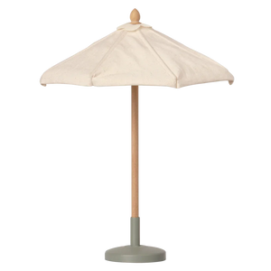 The Maileg Miniature Sunshade, a beige patio umbrella with a wooden pole and round gray base, offers perfect terrace shade and is displayed against a plain background.