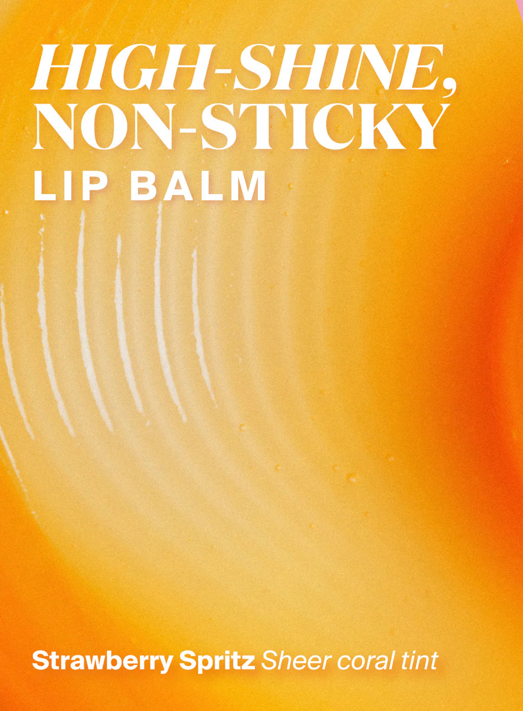 Text reads “Supergoop Glow Gloss Lip Balm SPF 40 - Strawberry Spritz: Sheer coral tint delivers ultra-hydrated, high-shine, non-sticky lips” over a bright orange-yellow abstract background.
