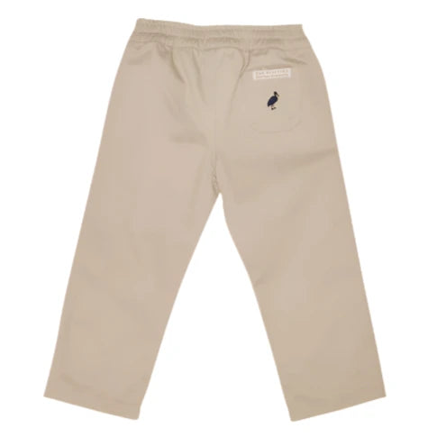 The Beaufort Bonnet Company Baby Boys' and Boys' Sheffield Pants in beige, shown from the back, have an elastic waistband and a single pocket with a small embroidered bird detail.