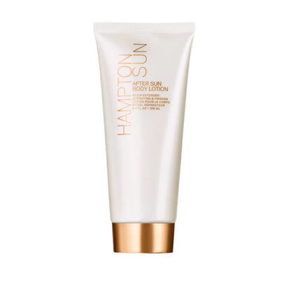 A white tube of Hampton Sun After Sun Body Lotion with gold accents and a skin-firming formula stands upright against a plain white background.