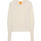 The Shrunken Crew Cashmere Sweater by Guest in Residence is a cream-colored women's slim fit with long sleeves, ribbed cuffs and hem, and a classic crew neckline, crafted from lightweight knit fabric. Laid flat on a white background.