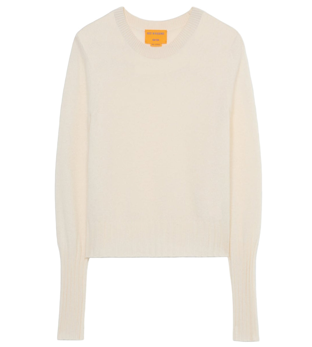 The Shrunken Crew Cashmere Sweater by Guest in Residence is a cream-colored women's slim fit with long sleeves, ribbed cuffs and hem, and a classic crew neckline, crafted from lightweight knit fabric. Laid flat on a white background.