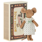 A charming Maileg Big Sister Mouse in a white nightgown stands beside a vintage-style matchbox labeled "Mouse Race," adorned with an illustration of a car and a mouse, making it an ideal toy for kids.