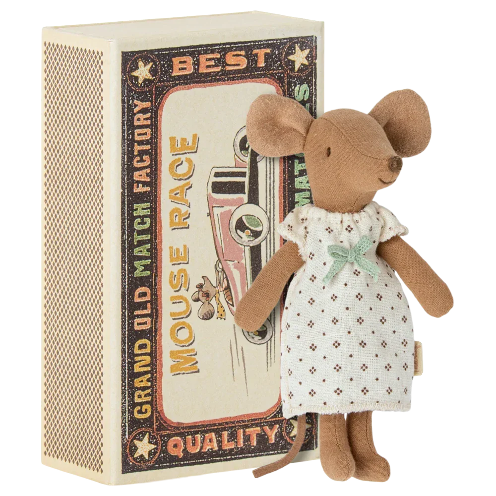 A charming Maileg Big Sister Mouse in a white nightgown stands beside a vintage-style matchbox labeled "Mouse Race," adorned with an illustration of a car and a mouse, making it an ideal toy for kids.