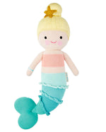 Skye the Mermaid by Cuddle + Kind is a 20" knitted plush with blonde hair in a bun, starfish hair accessory, pink top, and blue-green tail—an adorable addition to any seashell collection or ocean-themed playtime.