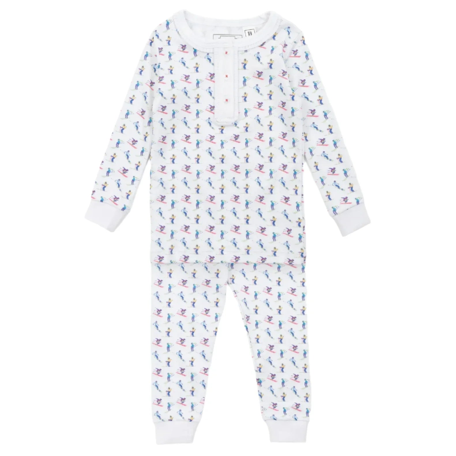 The Lila & Hayes Alden Girls' Pajama Pant Set is a white pajama set for children, showcasing vibrant, small cartoon dinosaurs with a button-up collar, made from soft Peruvian cotton.