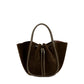 The Small Ruched Soft Suede Tote by Proenza Schouler, showcased in dark brown with a sculptural silhouette, features round handles and a drawstring closure and is photographed against a plain white background.